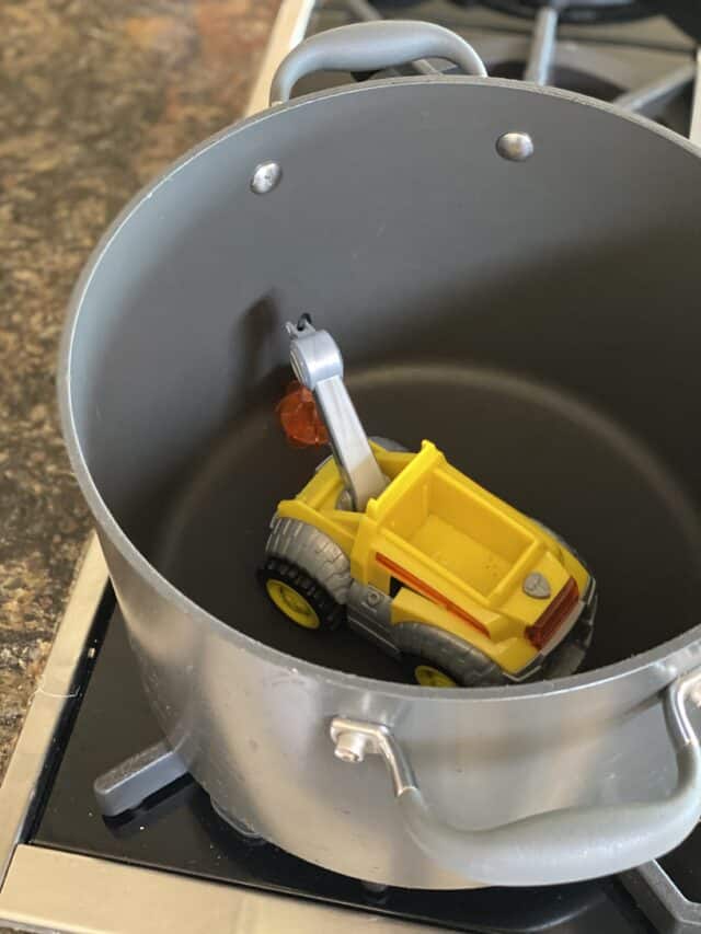 yellow Paw Patrol toy inside a kitchen pot