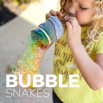 girl makes bubble snakes with a pool noodle and sock